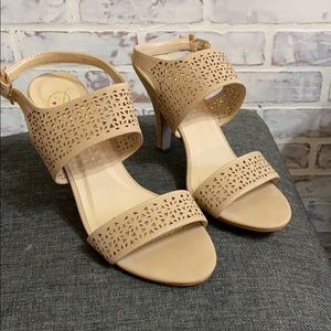 Light tan heeled sandals with laser cut bands